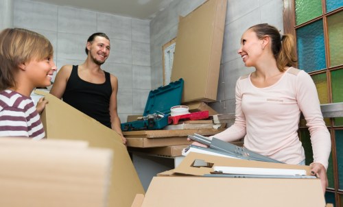 Moving boxes and furniture being loaded for a home move in Barnet