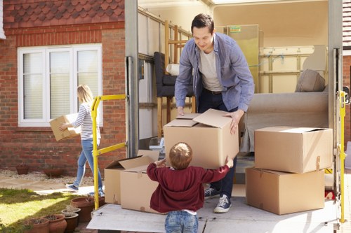 Team member checking workplace safeguards in a Barnet removal company