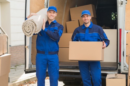 Professional house removalists in Barnet loading moving boxes into a van