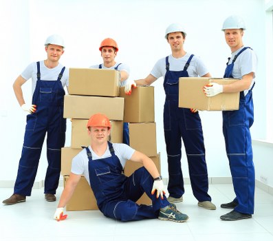 Household moving boxes and furniture prepared for man and van service
