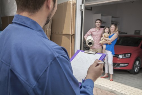 Removal team preparing boxes and furniture for a Barnet home move