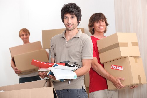Packed moving boxes and furniture ready for transport in Barnet