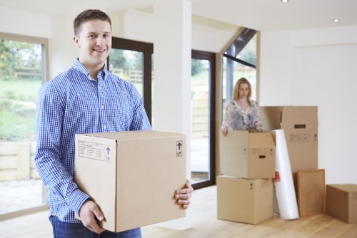 Furniture removals team handling a sofa in Barnet