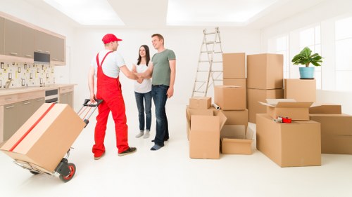 Removal team handling household items during a Barnet move