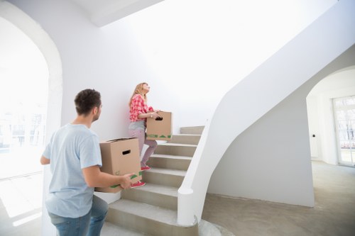 Professional movers carrying furniture with care