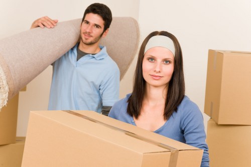 Removal team loading furniture into a vehicle during a scheduled move