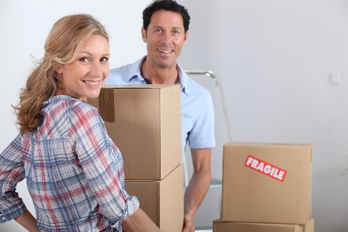 Local removals team handling furniture during a Barnet property move