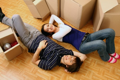 Removal workers using safe handling techniques during a move